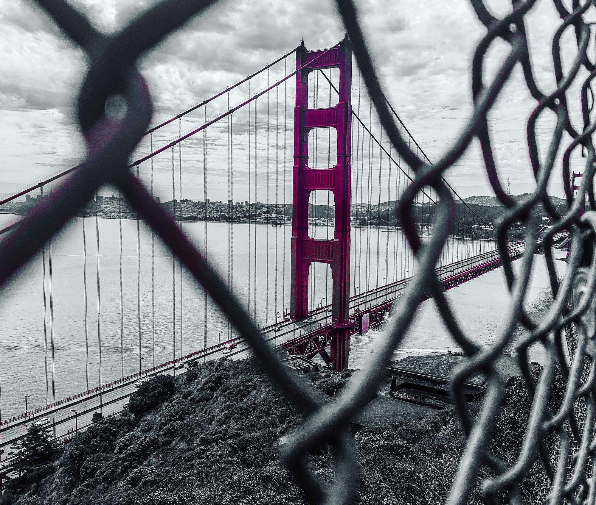 The Golden Gate Bridge framed through a chain